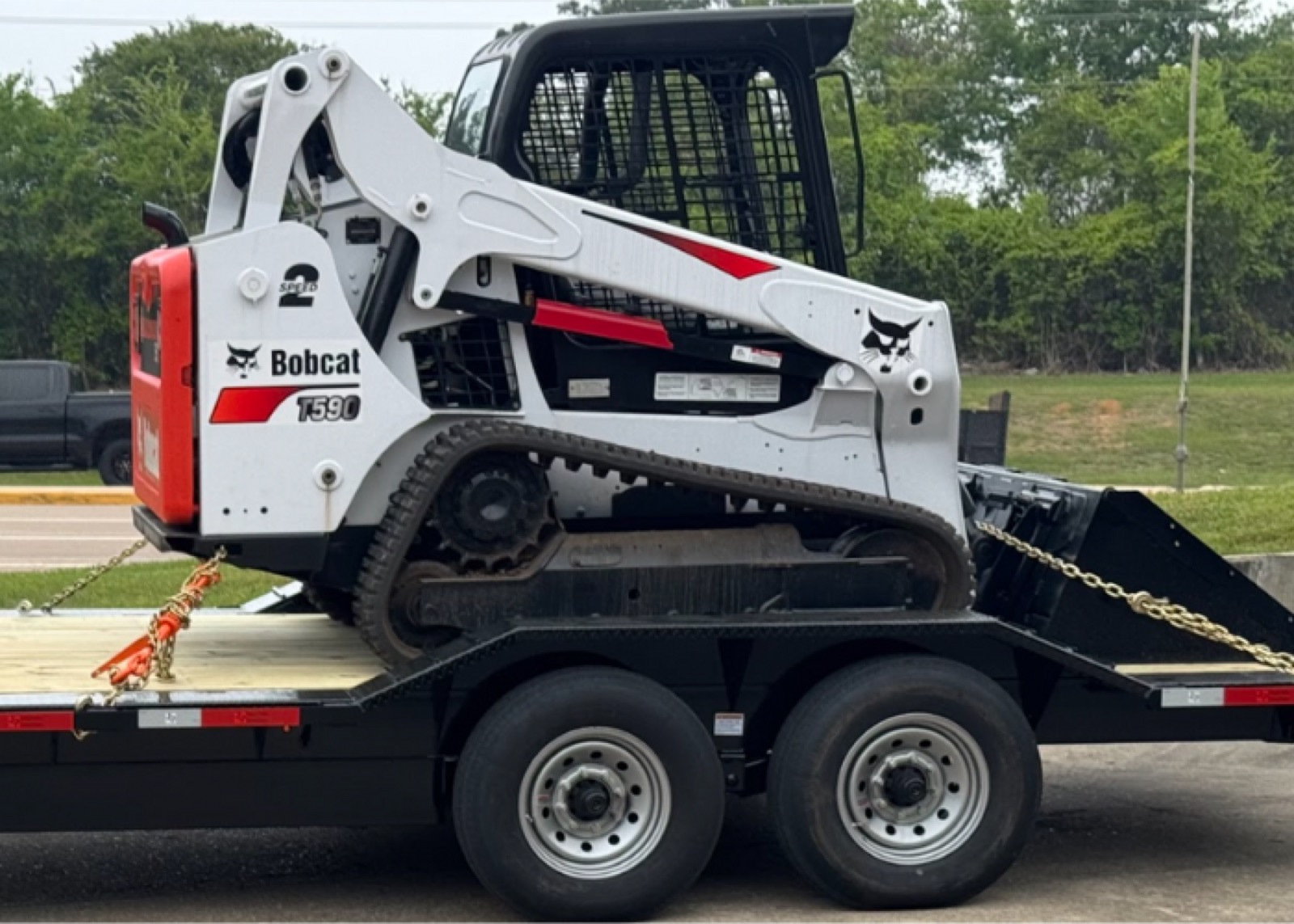 MoCo Trailer & Equipment Rentals compact track loader on a trailer in Montgomery, TX